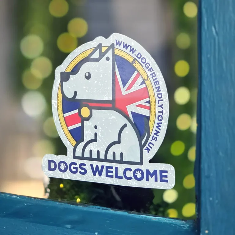 Dogs Welcome window sticker placed in door window